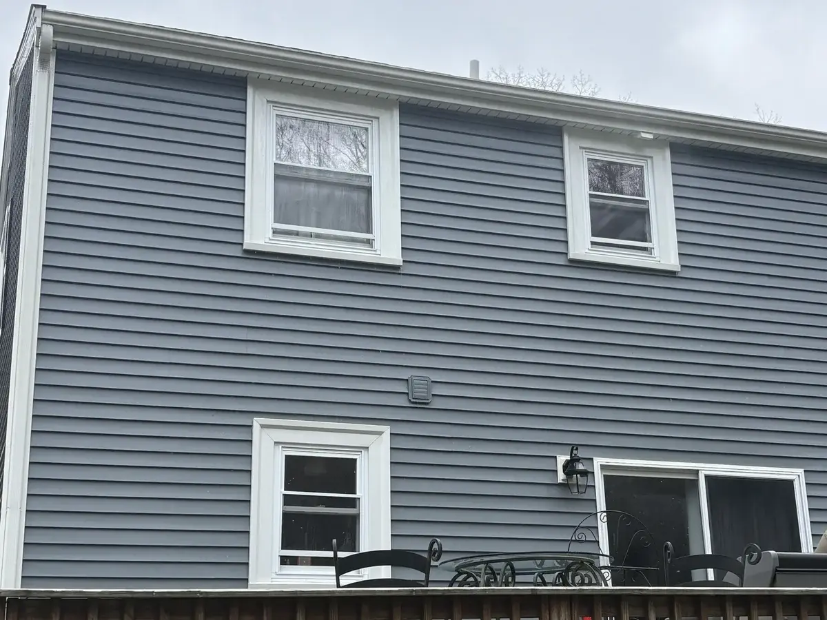 Clean gray vinyl siding after professional soft wash house washing in Bellingham MA