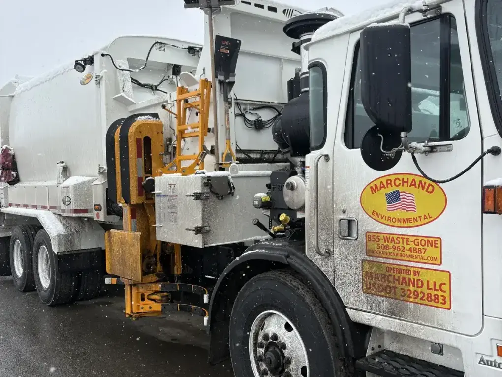 Waste management truck before fleet washing - dirty and snow-covered