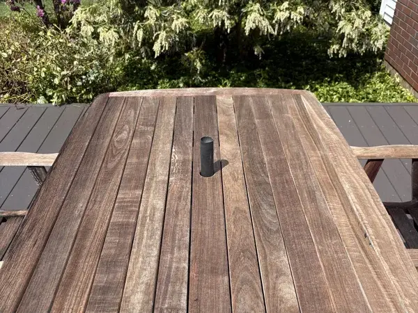 Clean restored deck table after professional power washing in Mendon MA