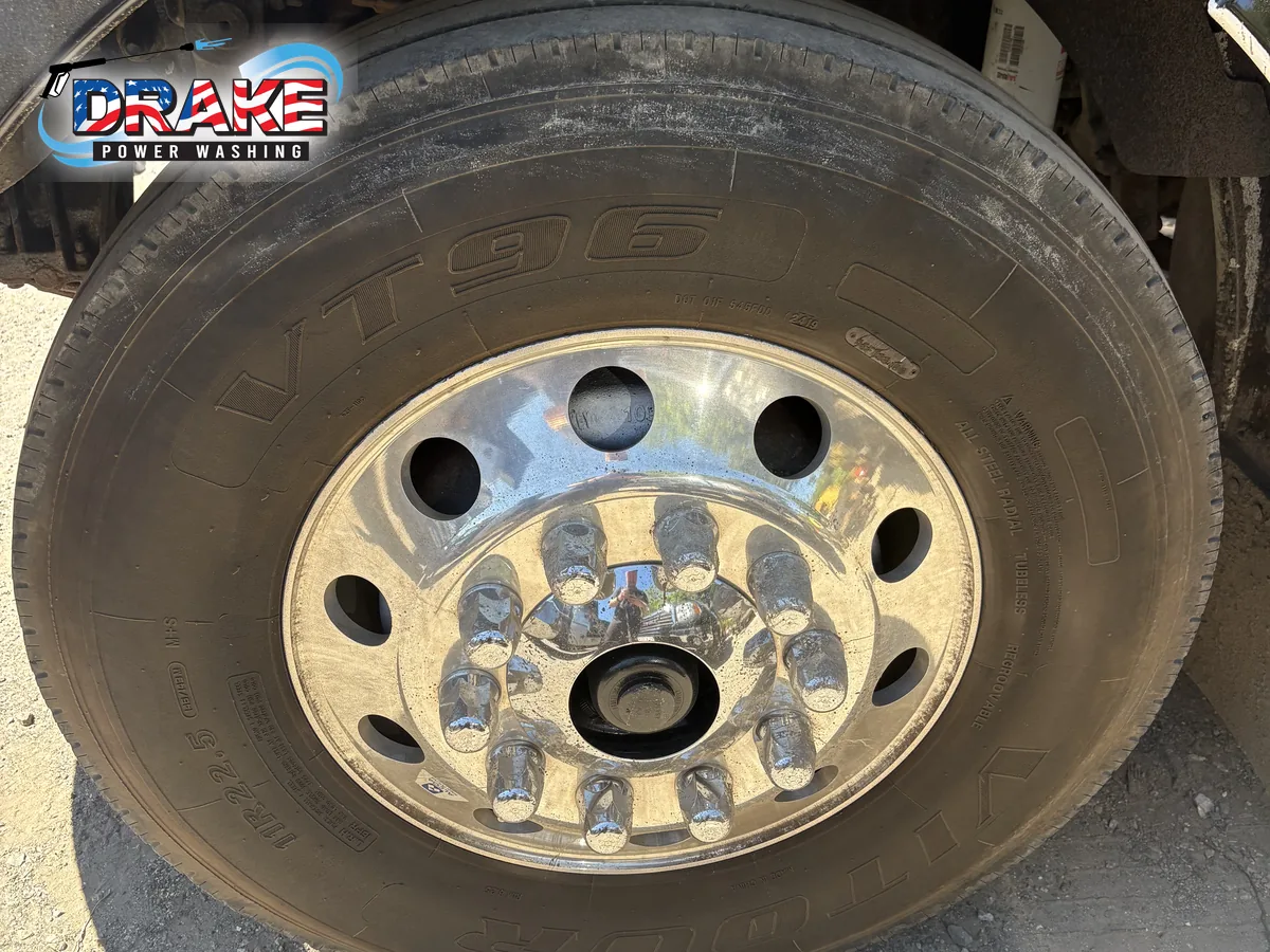 Truck wheel before detailed fleet washing in Medfield