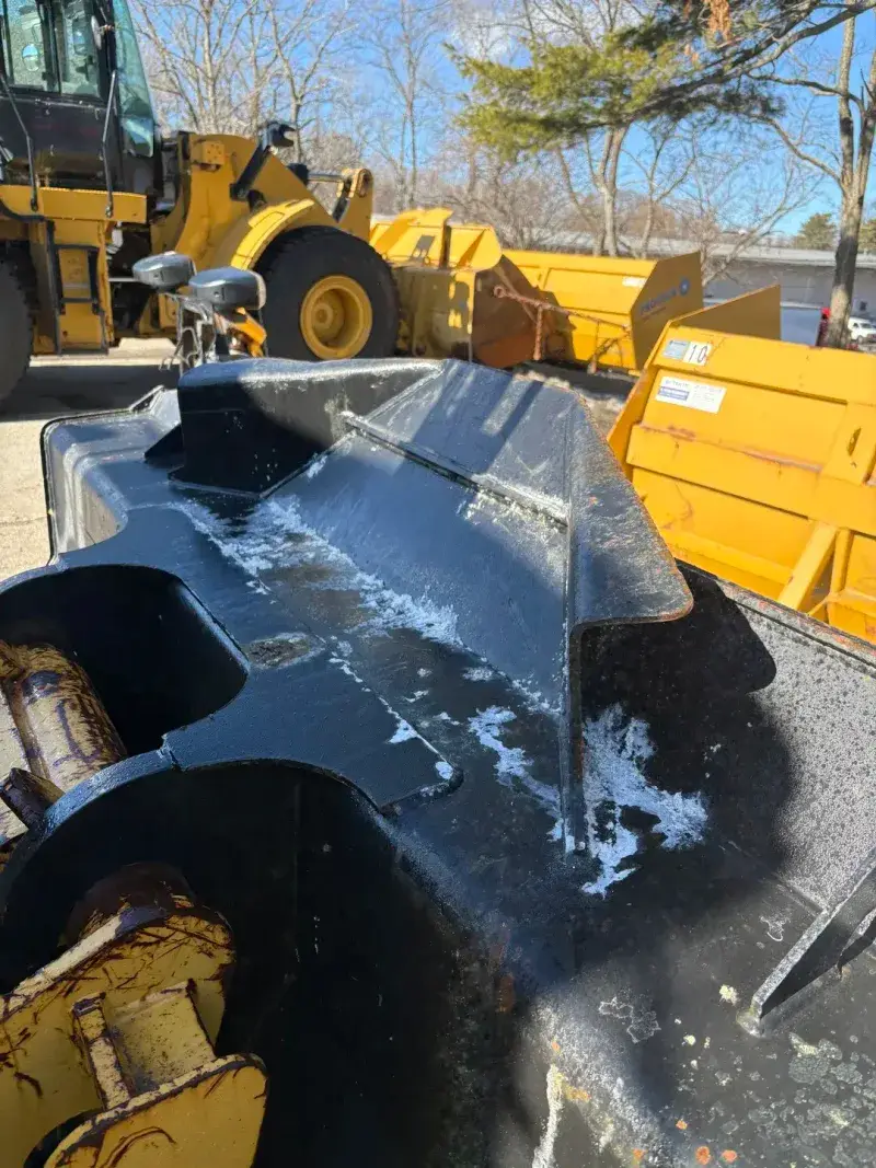 Heavy equipment covered in salt and grime before cleaning