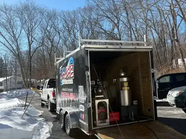 Drake Power Washing branded trailer with professional steam ice dam removal equipment