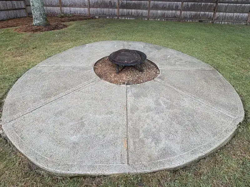 Clean concrete patio after professional power washing
