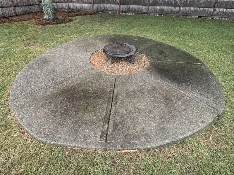 Concrete patio with stains before cleaning