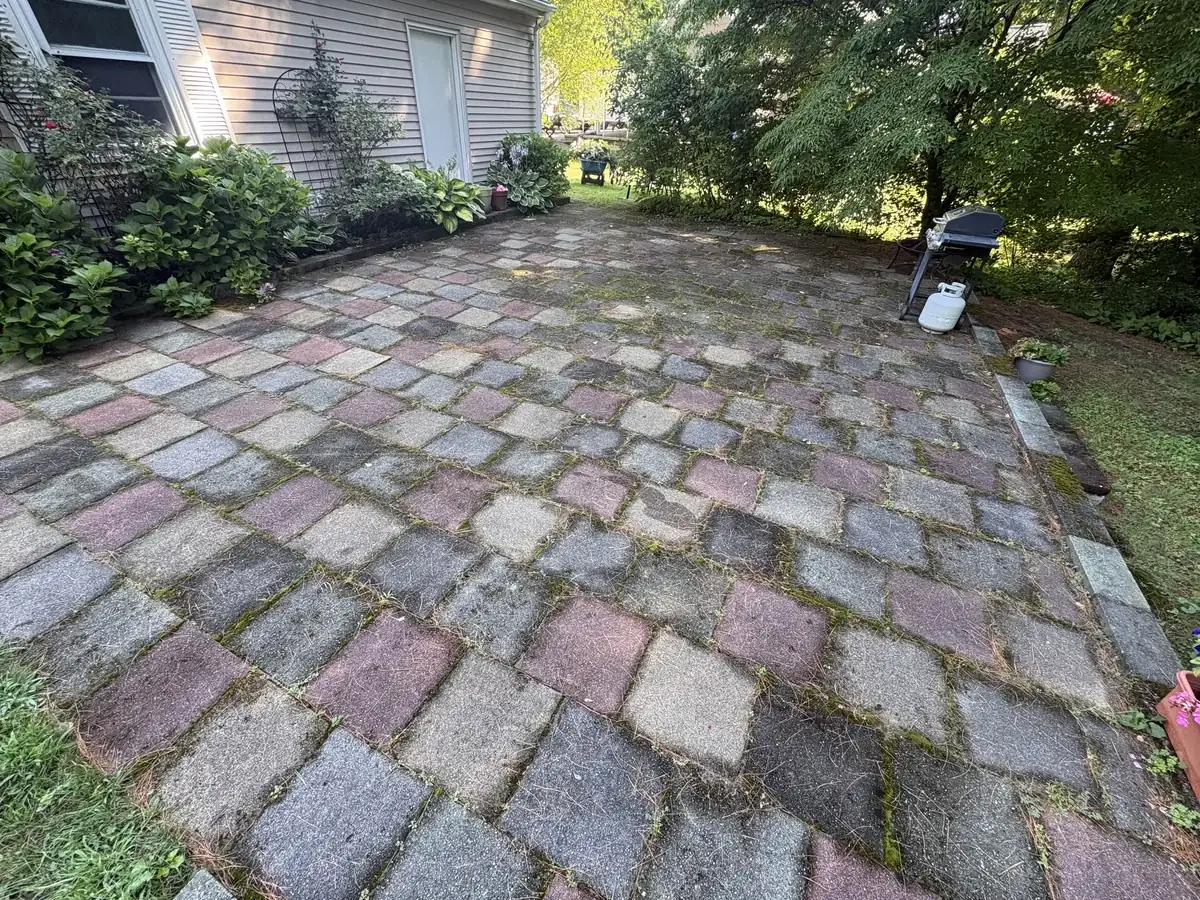 Stained patio in Foxborough MA before power washing