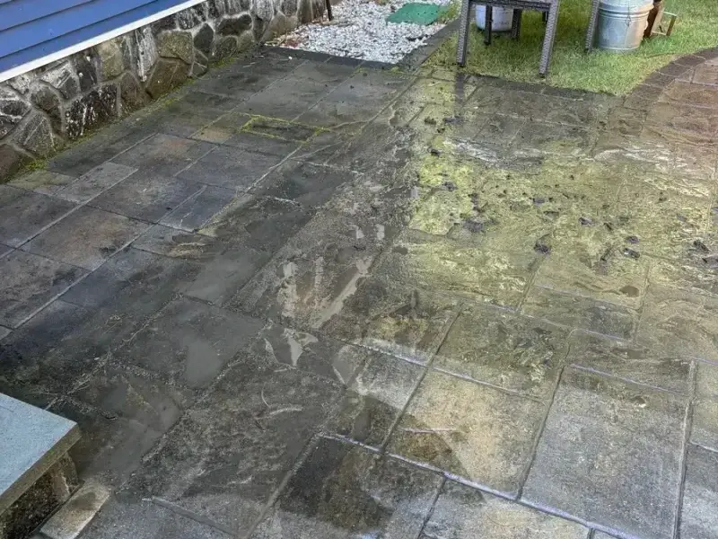 Patio before cleaning with heavy stains