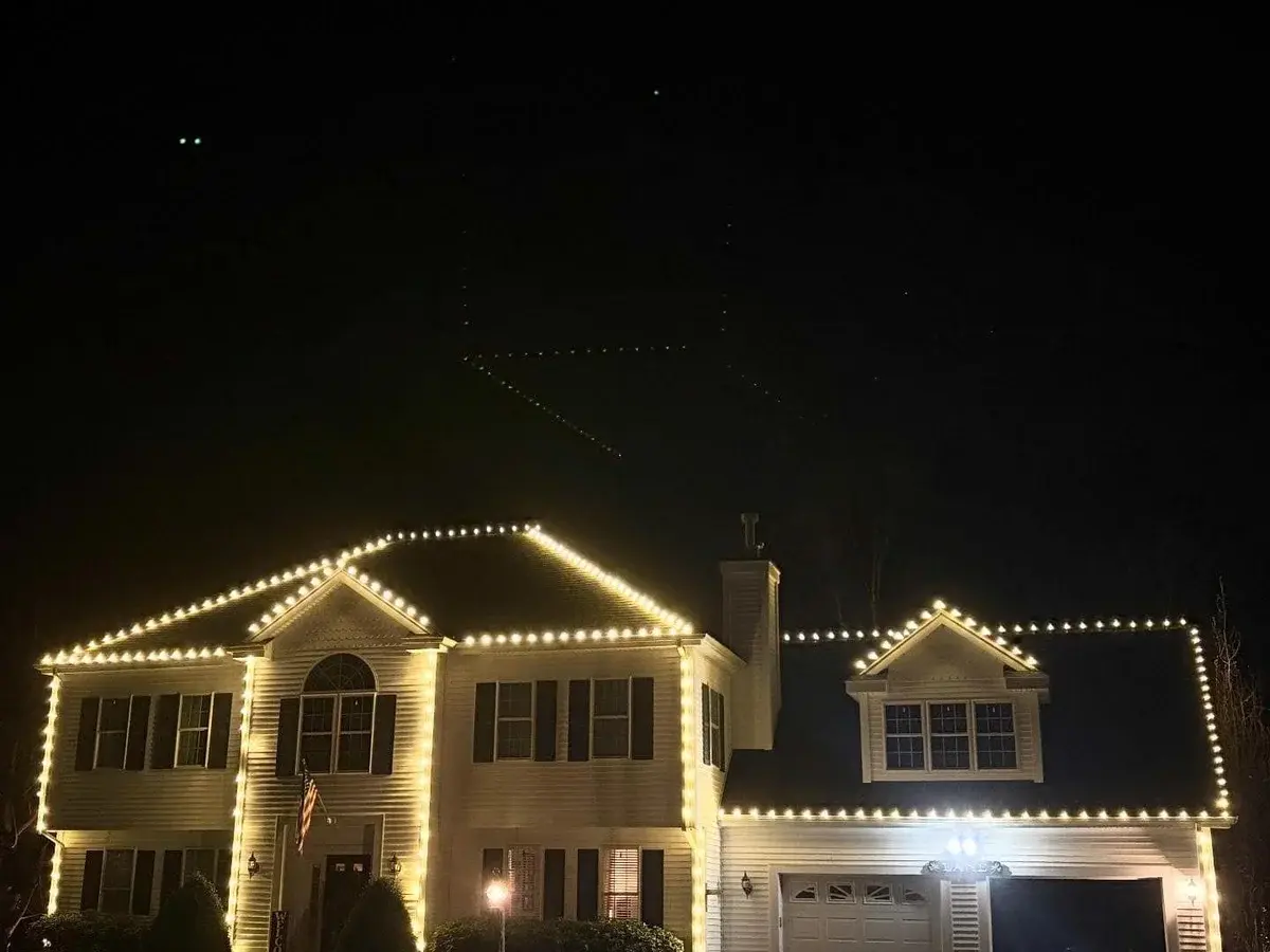 Permanent outdoor lighting display on home exterior