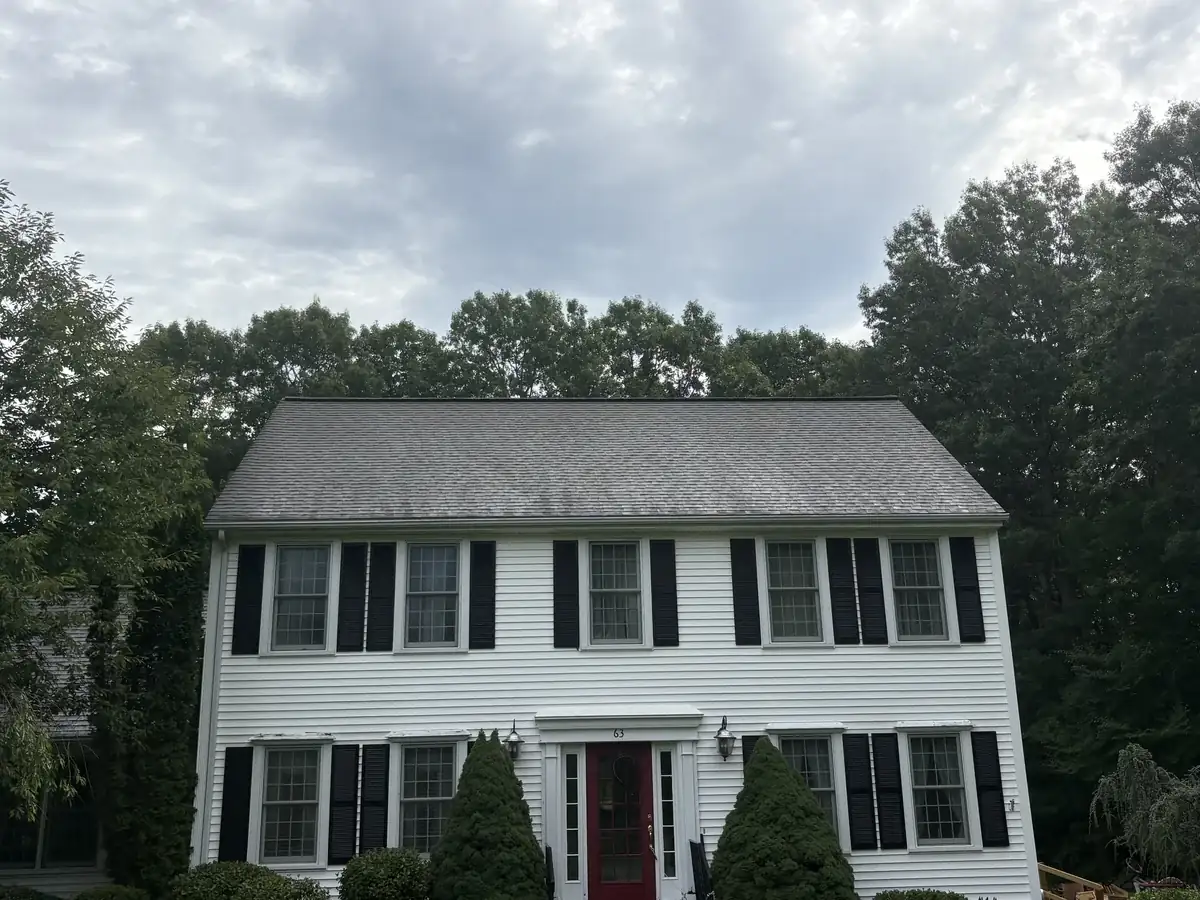 Colonial home in Northbridge MA with streaked roof before soft washing
