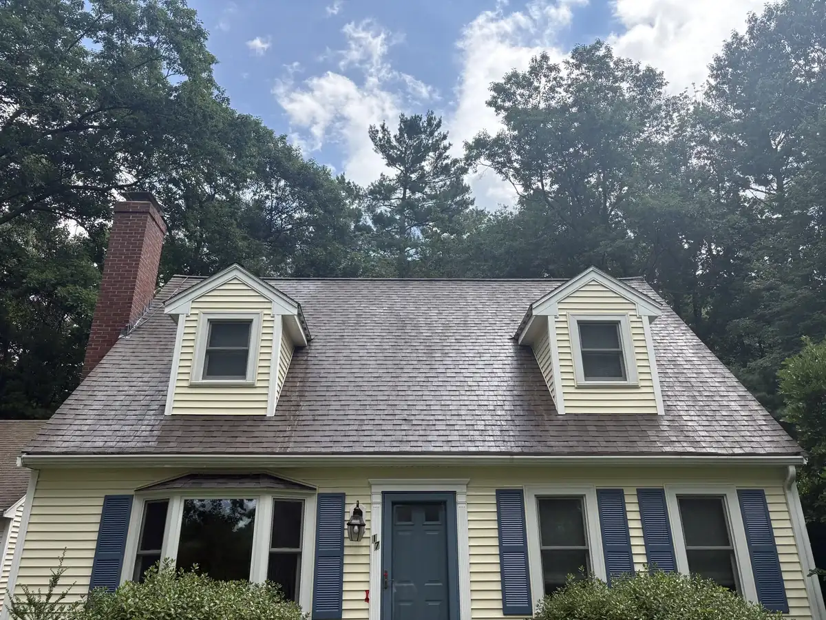Roof in Upton MA after soft wash cleaning by Drake Power Washing