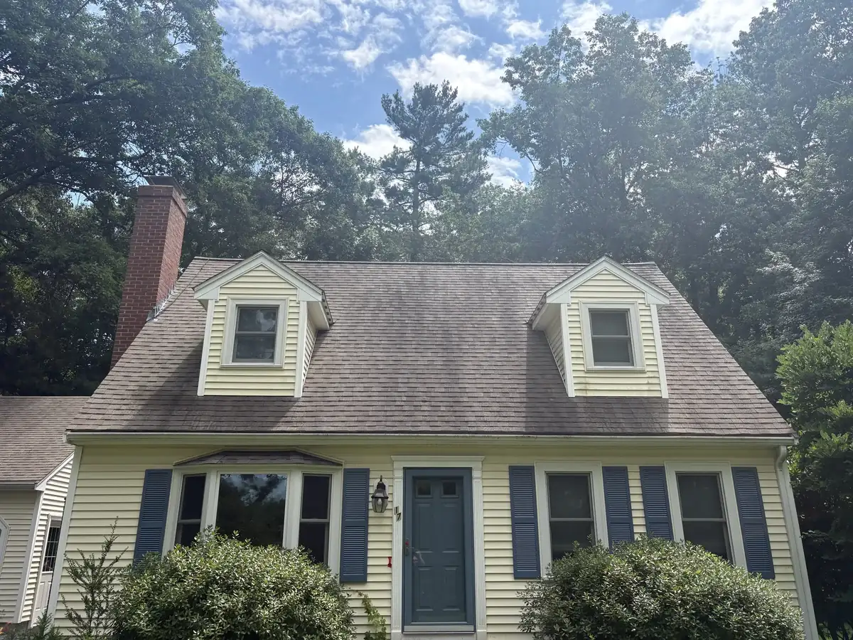 Roof in Upton MA with black streaks before cleaning